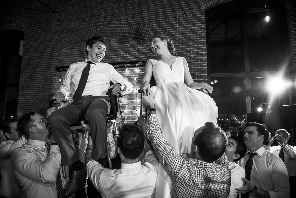 bride and groom during the horah wedding at Charles river museum of industry and innovation
