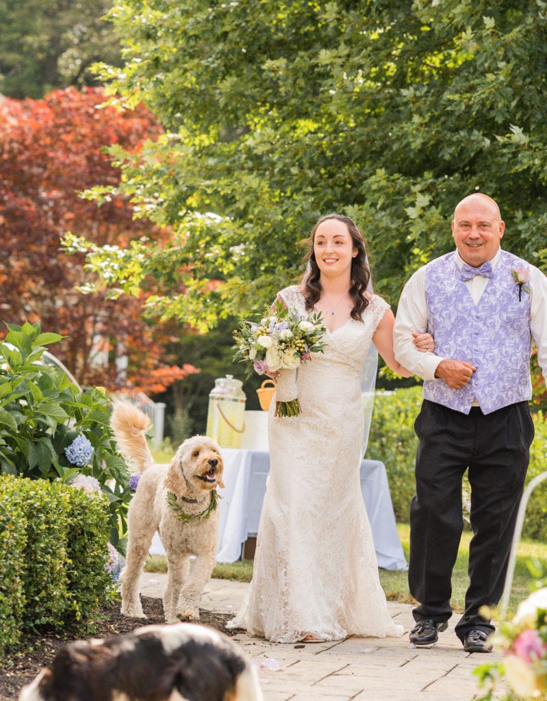 Father walking daughter down aisle